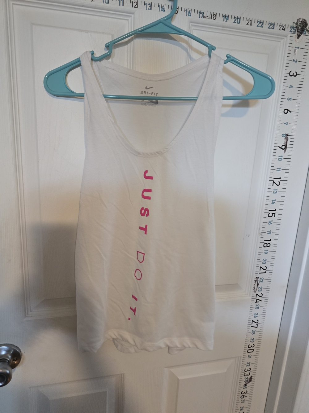 Nike White Dri-FIT Tank with Vertical Pink "Just Do It." Logo